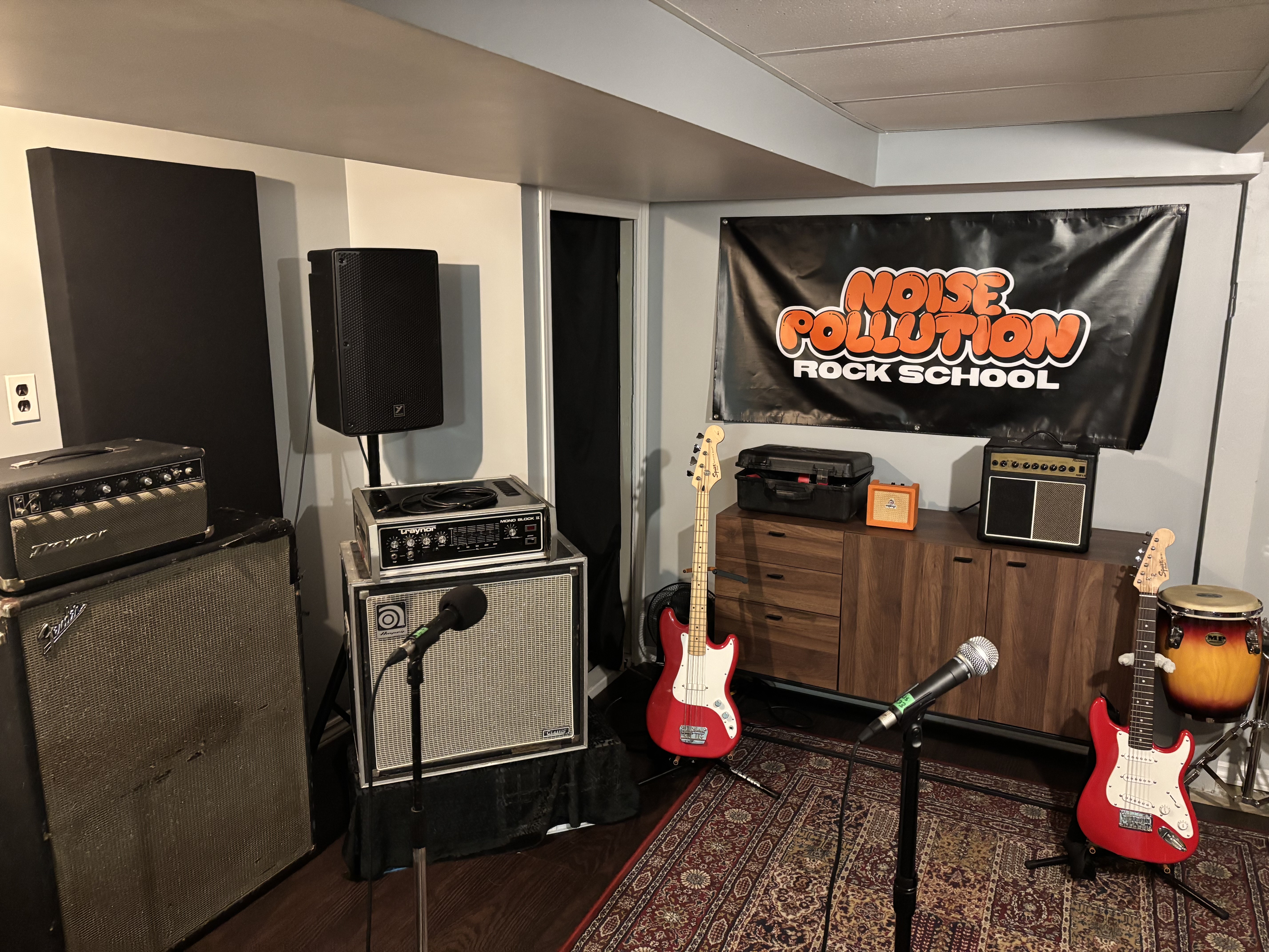noise pollution rock school's studio space with all the different instruments like drums, guitar, bass, and keyboards